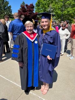 MCB graduate with Dept. Head, Carol Teschke