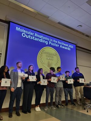 Outstanding Poster winners on stage at the Molecular Biophysics in the Northeast 2025