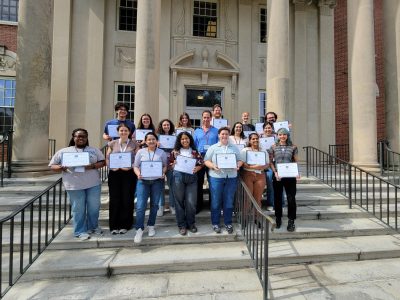 2026 Summer Named fellowship winners standing outside Wilbur Cross building