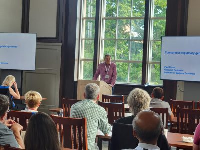Dr. Filcek, Research Professor, standing at podium delivering talk about his resesarch