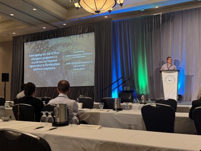 Russ Hanson, from the Goldhamer lab shown presenting at the convention.